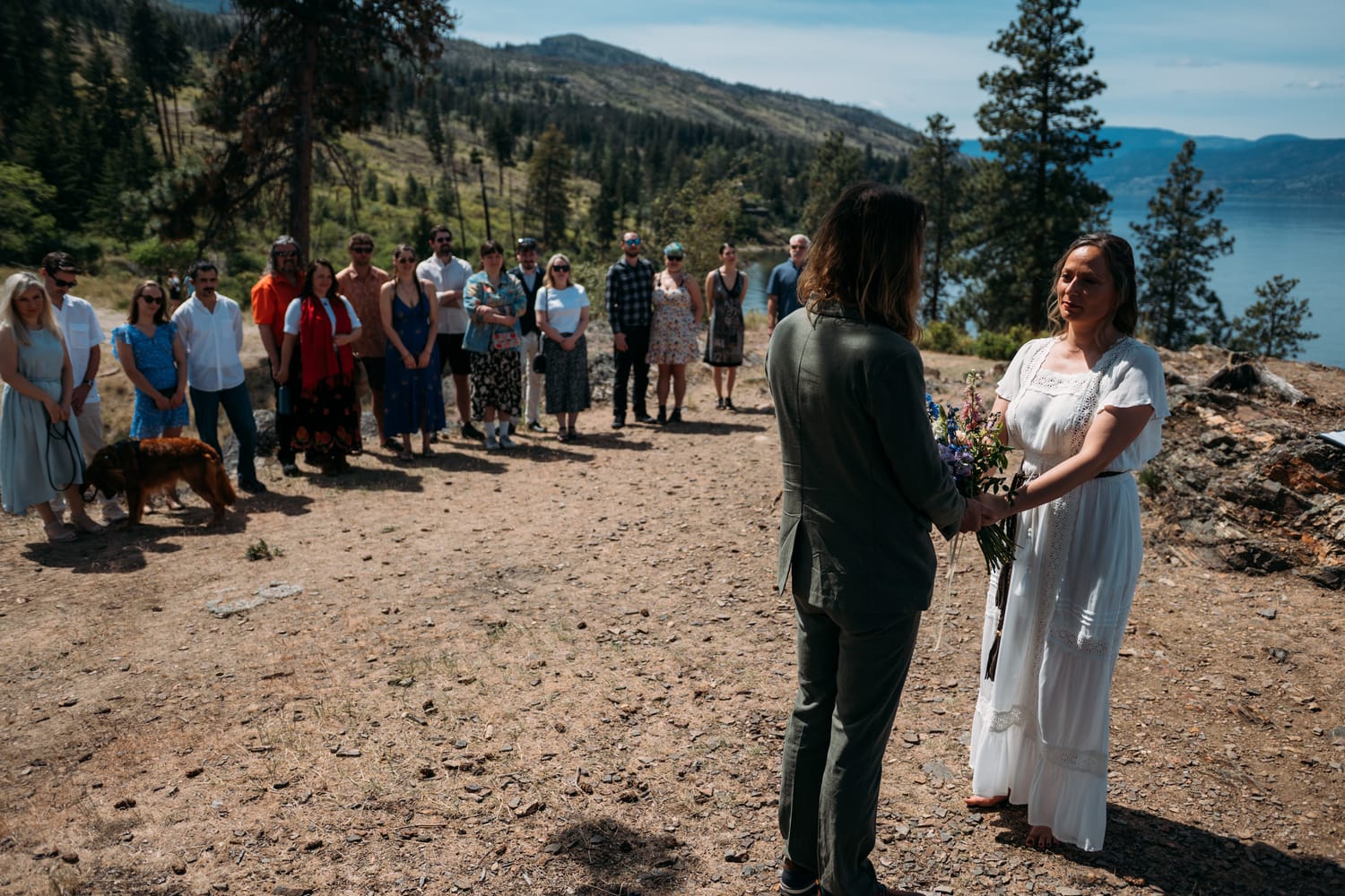 Kristina and Mark weddings story frame 9: A Bertram Creek wedding in South Kelowna with Okanagan Lake light, film-friend history, family texture and Lithuanian food and planning details..