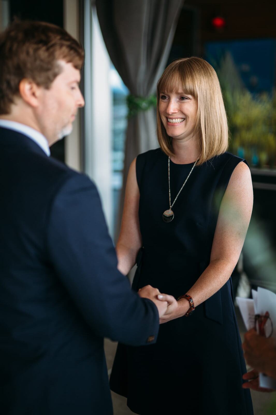 Kristine and Mike weddings story frame 12: A small downtown Kelowna wedding at the Kelowna Yacht Club, with sweet family, detail frames, flattering angles and quiet waterfront polish..