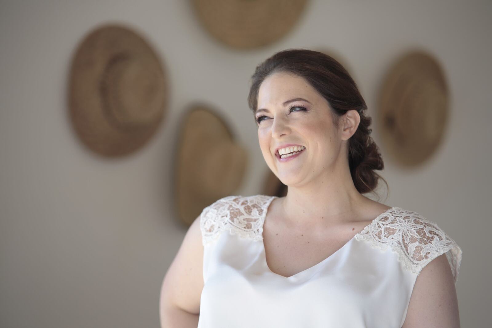 Kyra smiling during her bridal preparations