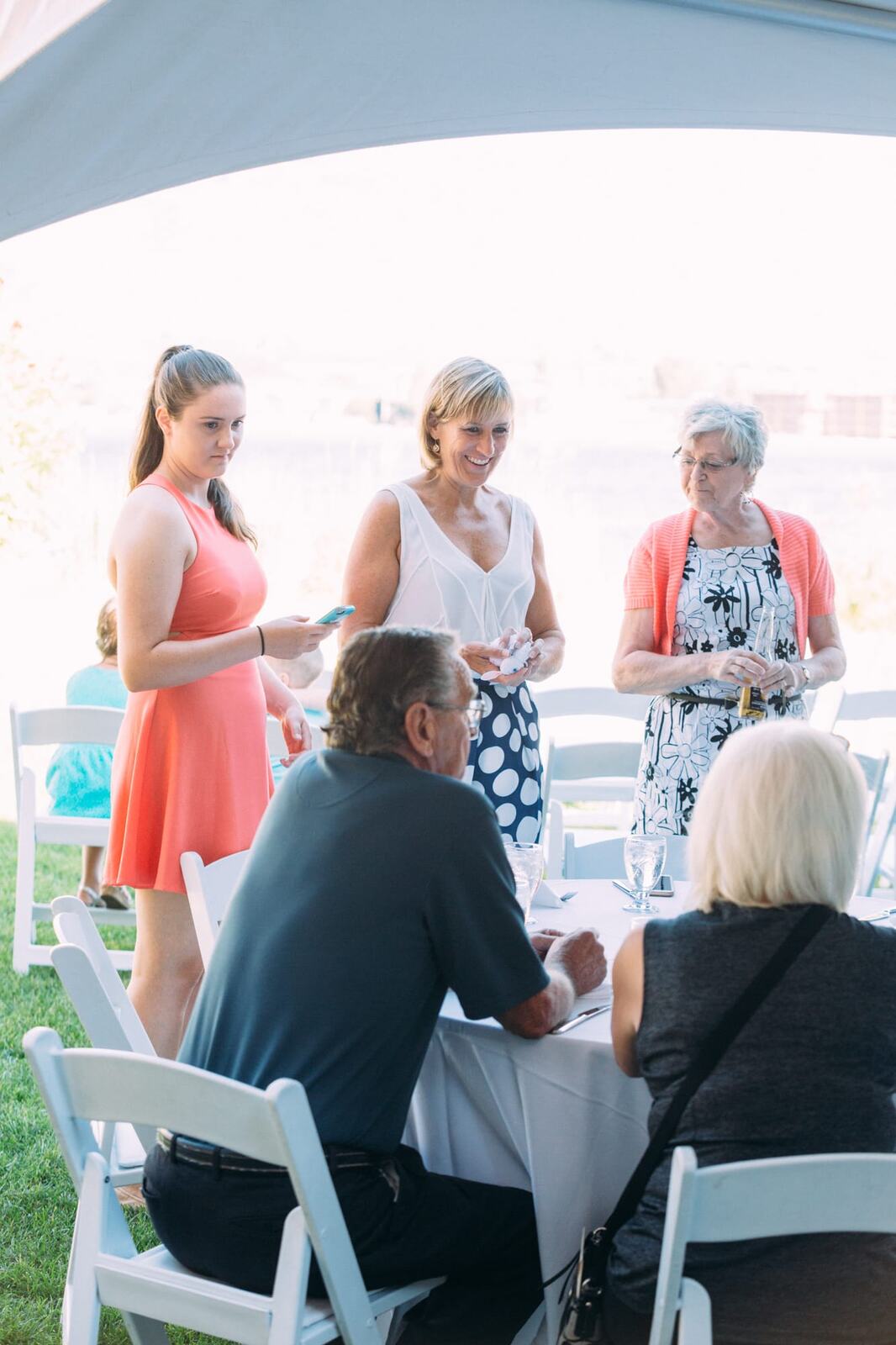 Leeanne and Kelly weddings story frame 10: A Watermark Beach Resort wedding in Osoyoos, built around lakefront context, grown-family connection and careful, big-hearted coverage..