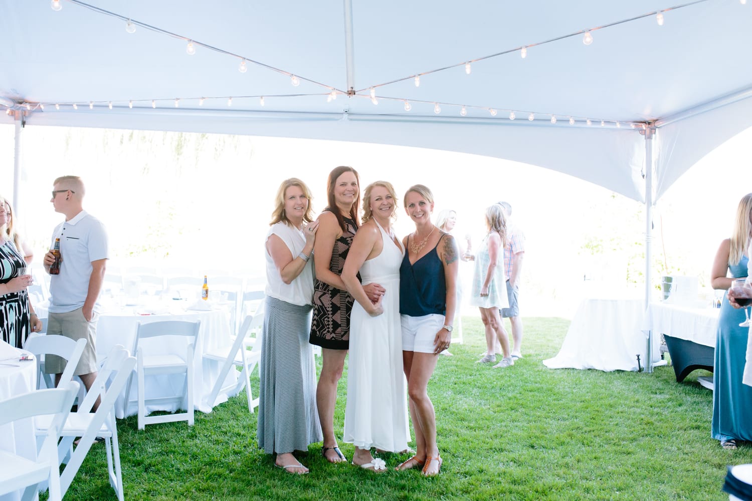 Leeanne and Kelly weddings story frame 13: A Watermark Beach Resort wedding in Osoyoos, built around lakefront context, grown-family connection and careful, big-hearted coverage..