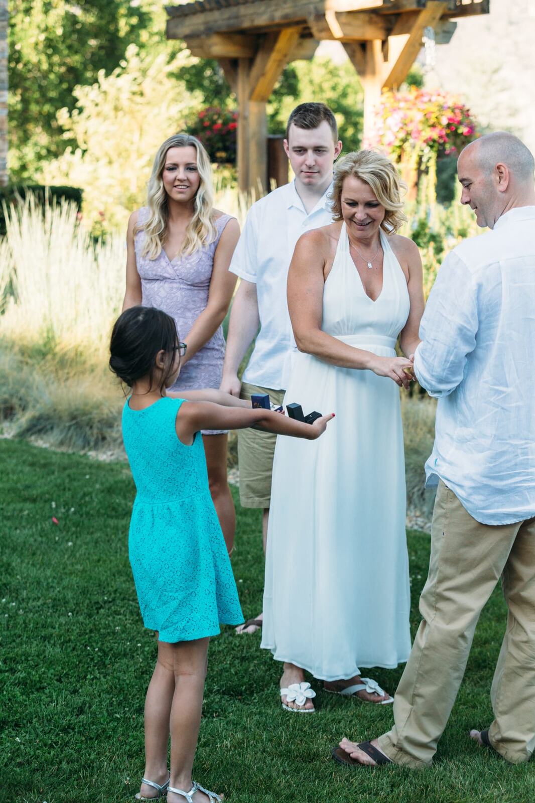 Leeanne and Kelly weddings story frame 17: A Watermark Beach Resort wedding in Osoyoos, built around lakefront context, grown-family connection and careful, big-hearted coverage..