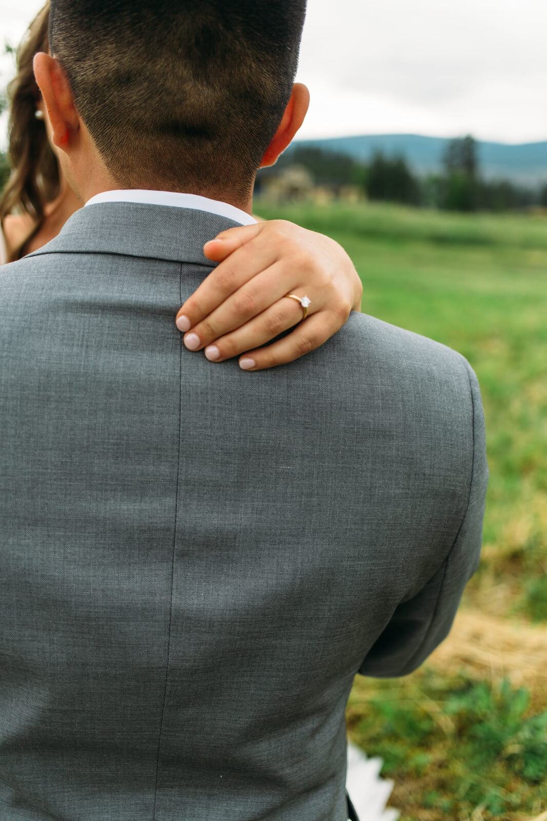 Leslie and Gerome weddings story frame 2: A Brook & Barn - Casorso Heritage Farm wedding in Kelowna, with orchard details, outbuildings, lawn games and a familiar friend-party feeling..