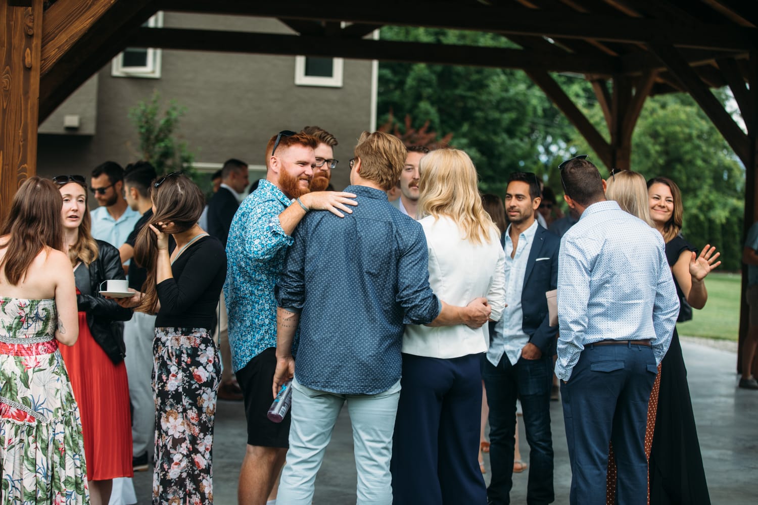 Leslie and Gerome weddings story frame 8: A Brook & Barn - Casorso Heritage Farm wedding in Kelowna, with orchard details, outbuildings, lawn games and a familiar friend-party feeling..