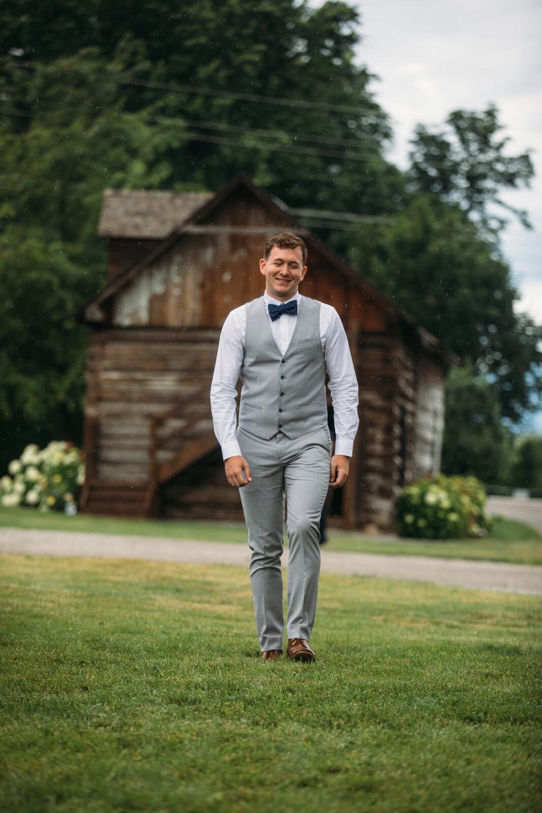 Leslie and Gerome weddings story frame 11: A Brook & Barn - Casorso Heritage Farm wedding in Kelowna, with orchard details, outbuildings, lawn games and a familiar friend-party feeling..