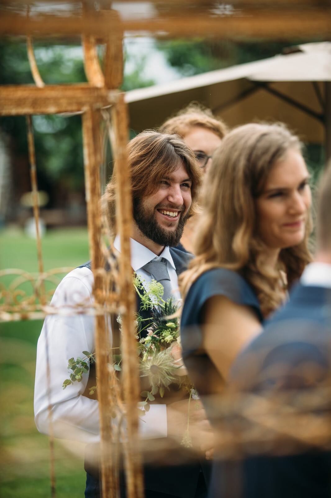 Leslie and Gerome weddings story frame 15: A Brook & Barn - Casorso Heritage Farm wedding in Kelowna, with orchard details, outbuildings, lawn games and a familiar friend-party feeling..