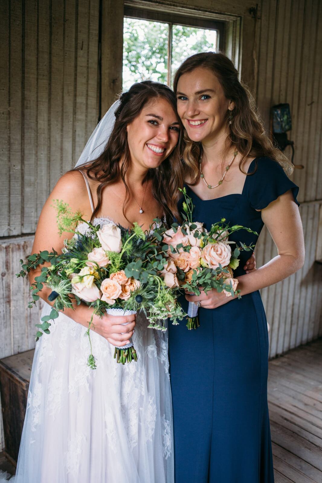 Leslie and Gerome weddings story frame 19: A Brook & Barn - Casorso Heritage Farm wedding in Kelowna, with orchard details, outbuildings, lawn games and a familiar friend-party feeling..