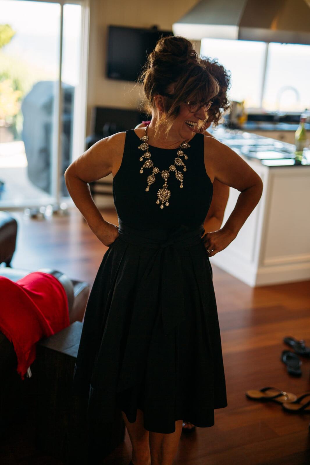 Mara and Casey weddings story frame 17: A Vancouver Island private-home wedding near Qualicum Beach, with Bowser prep, Friday gathering energy, custom vendors, kids, friends and cool Island air..