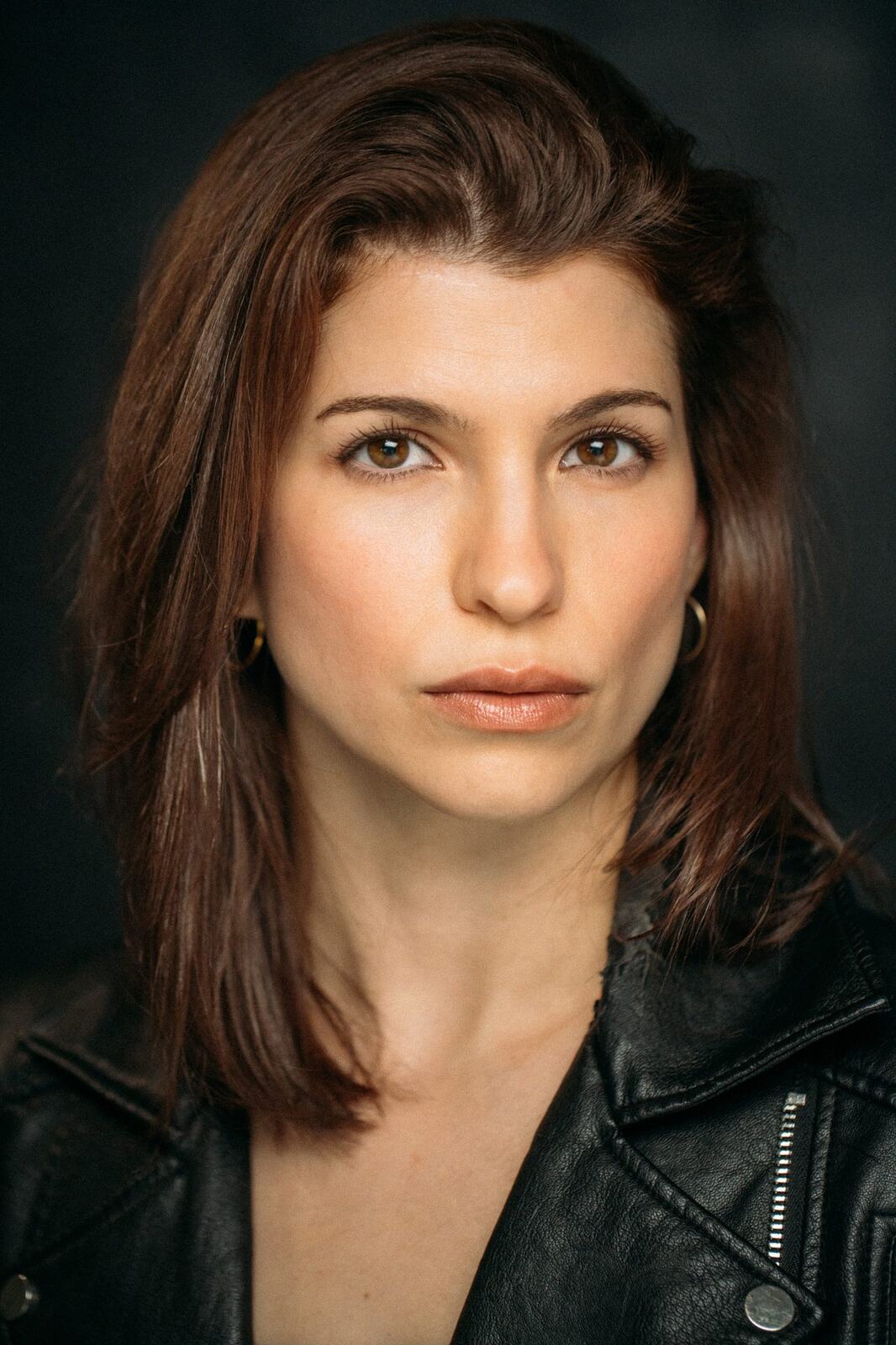Marie in a leather jacket for a close actor headshot