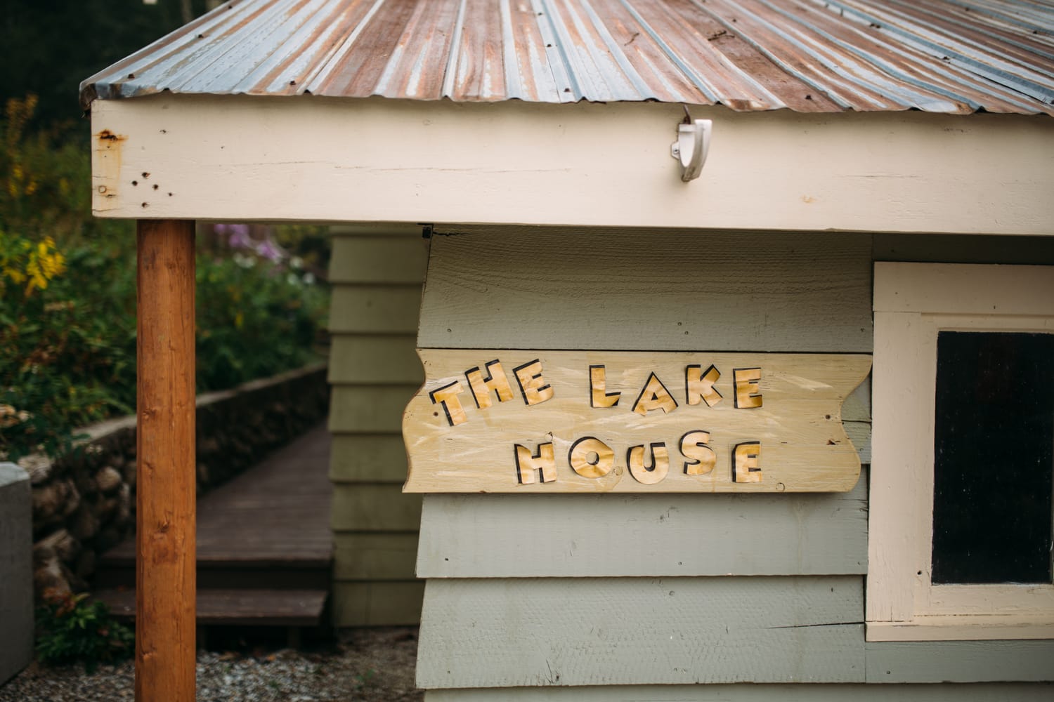 Marie and Mark weddings story frame 1: A Mabel Lake Airpark wedding in the North Okanagan, with grass-runway scenery, open-air photos and sweet family help around makeup, flowers and petals..