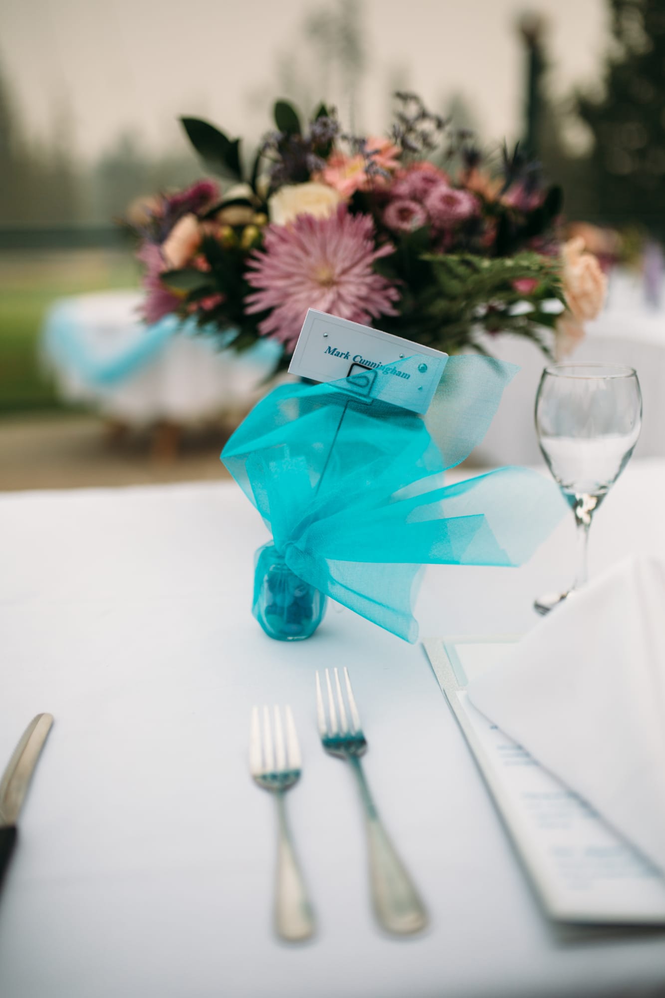 Marie and Mark weddings story frame 2: A Mabel Lake Airpark wedding in the North Okanagan, with grass-runway scenery, open-air photos and sweet family help around makeup, flowers and petals..