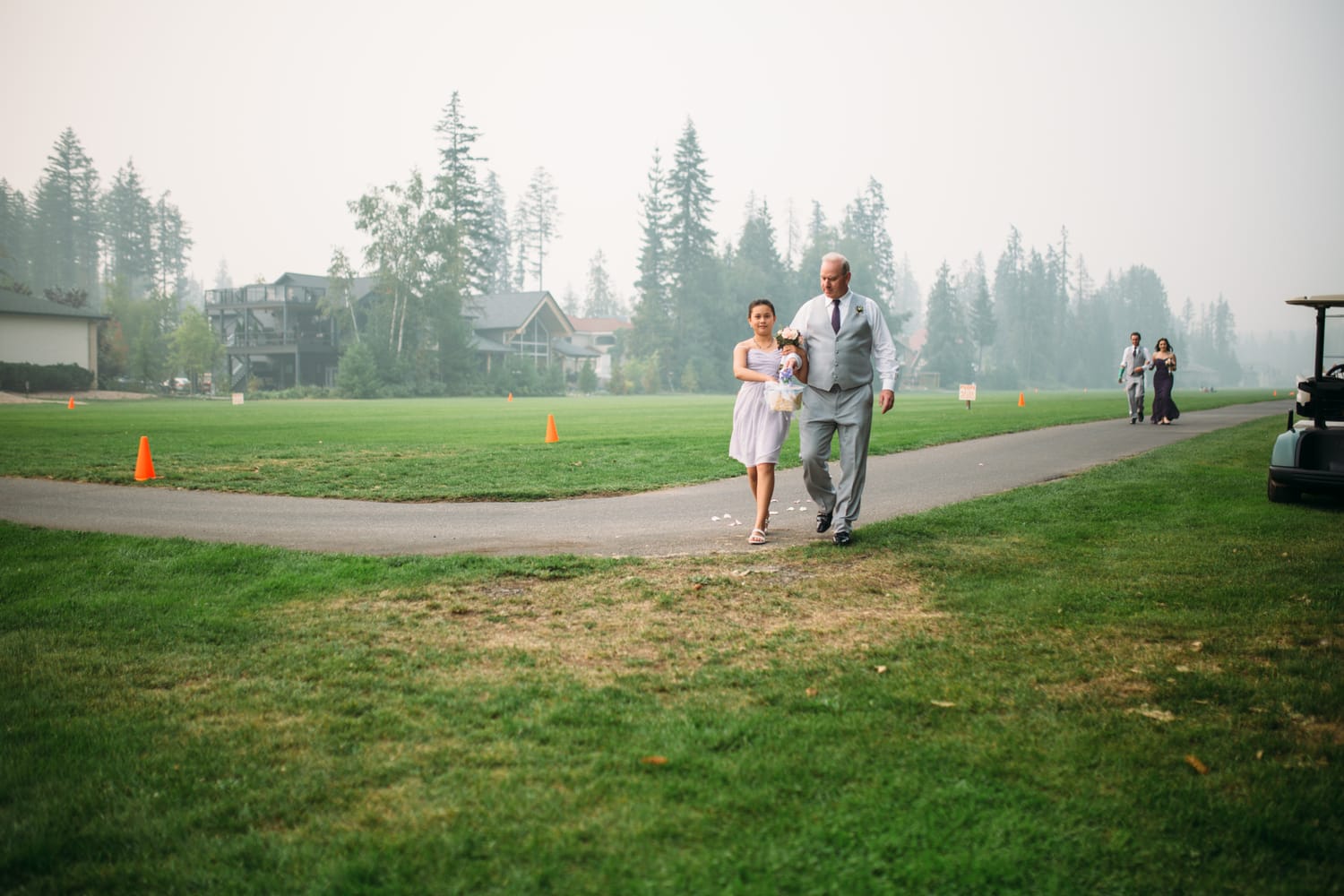 Marie and Mark weddings story frame 13: A Mabel Lake Airpark wedding in the North Okanagan, with grass-runway scenery, open-air photos and sweet family help around makeup, flowers and petals..