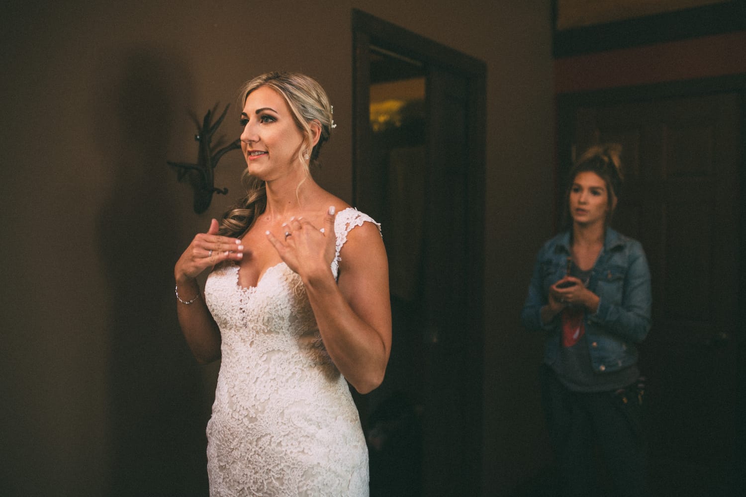 Megan and Jarid weddings story frame 2: A Shuswap-area wedding around Sicamous, Swansea Point and Hyde Mountain, with boat/lake context, cliff portraits and strong floral colour..