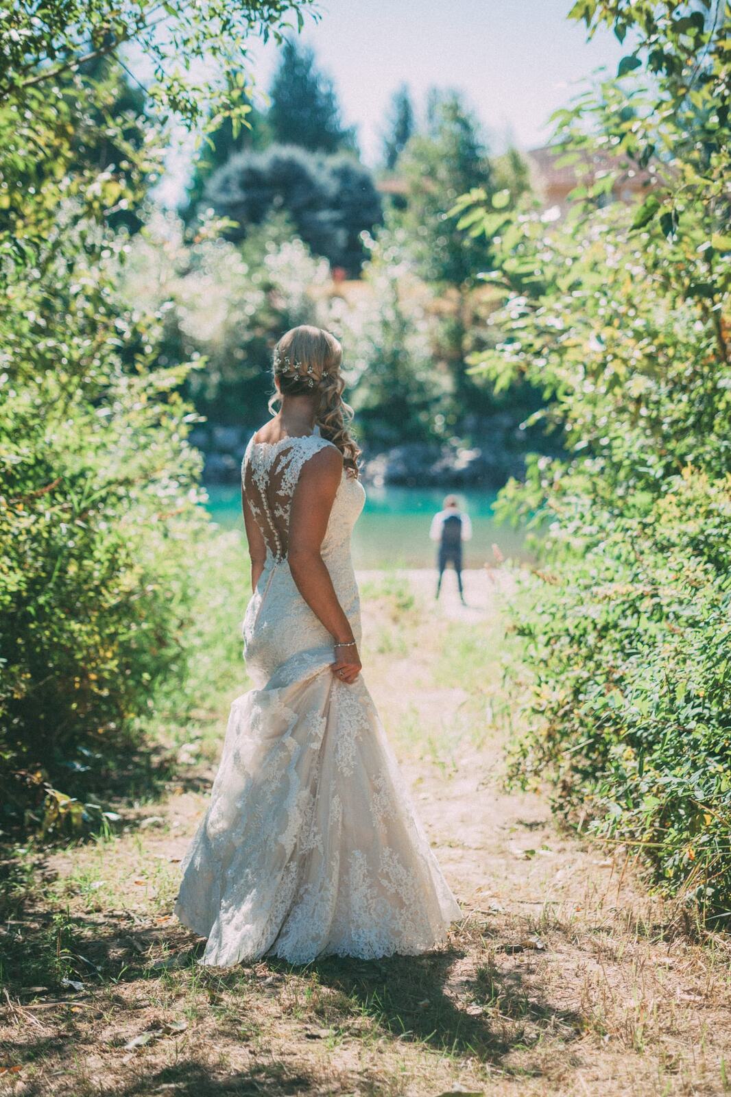 Megan and Jarid weddings story frame 4: A Shuswap-area wedding around Sicamous, Swansea Point and Hyde Mountain, with boat/lake context, cliff portraits and strong floral colour..
