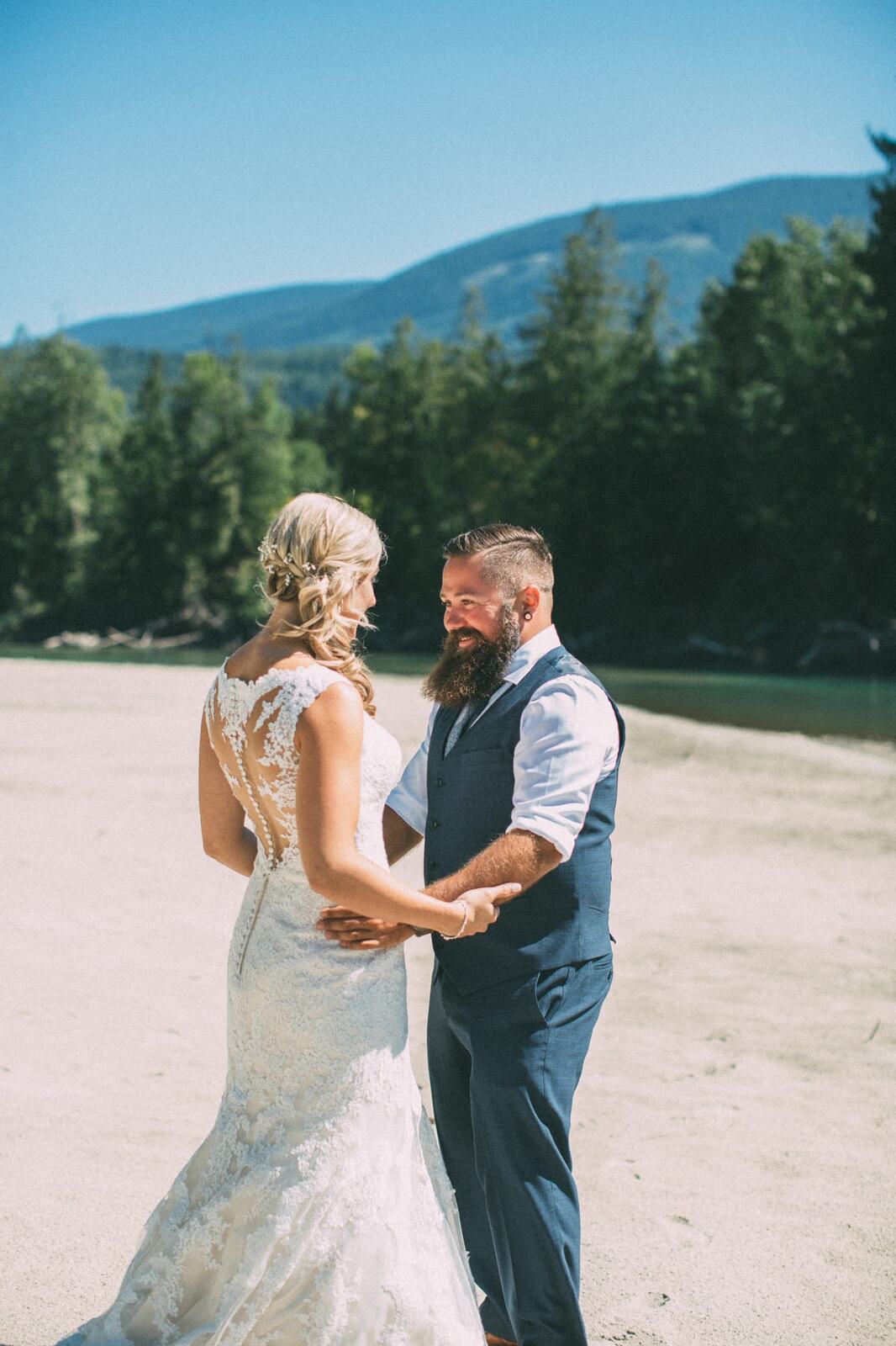 Megan and Jarid weddings story frame 5: A Shuswap-area wedding around Sicamous, Swansea Point and Hyde Mountain, with boat/lake context, cliff portraits and strong floral colour..