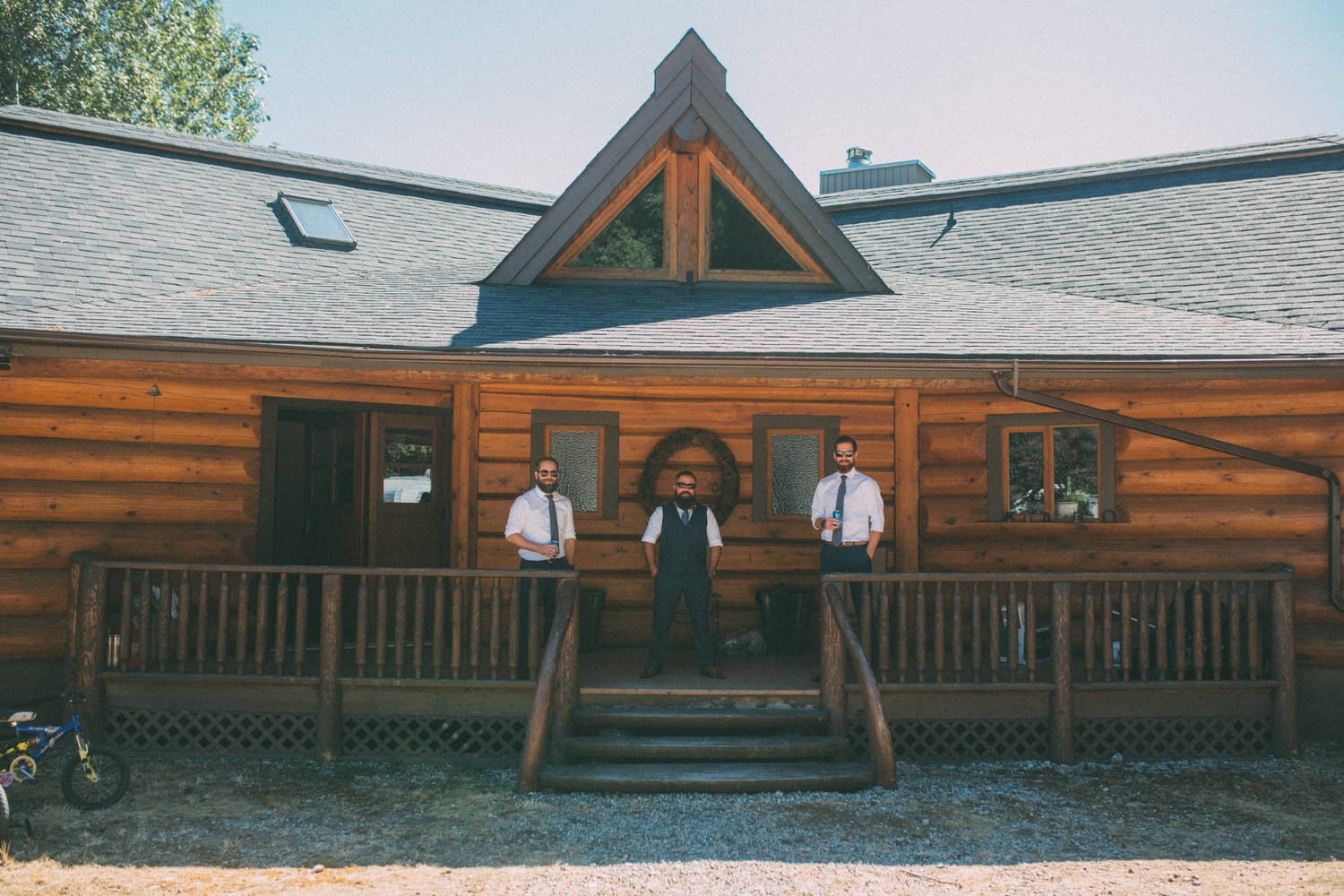 Megan and Jarid weddings story frame 7: A Shuswap-area wedding around Sicamous, Swansea Point and Hyde Mountain, with boat/lake context, cliff portraits and strong floral colour..