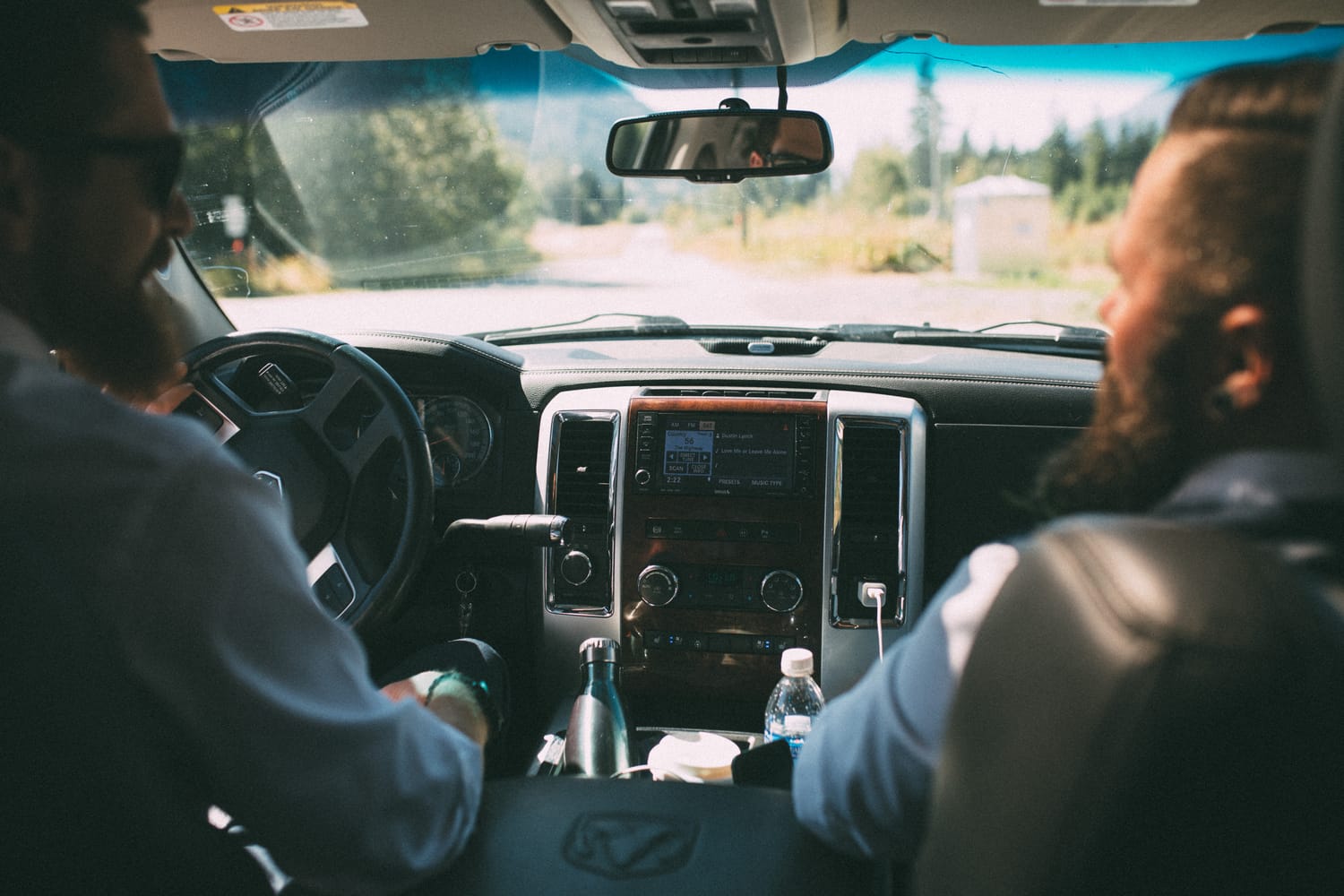 Megan and Jarid weddings story frame 8: A Shuswap-area wedding around Sicamous, Swansea Point and Hyde Mountain, with boat/lake context, cliff portraits and strong floral colour..
