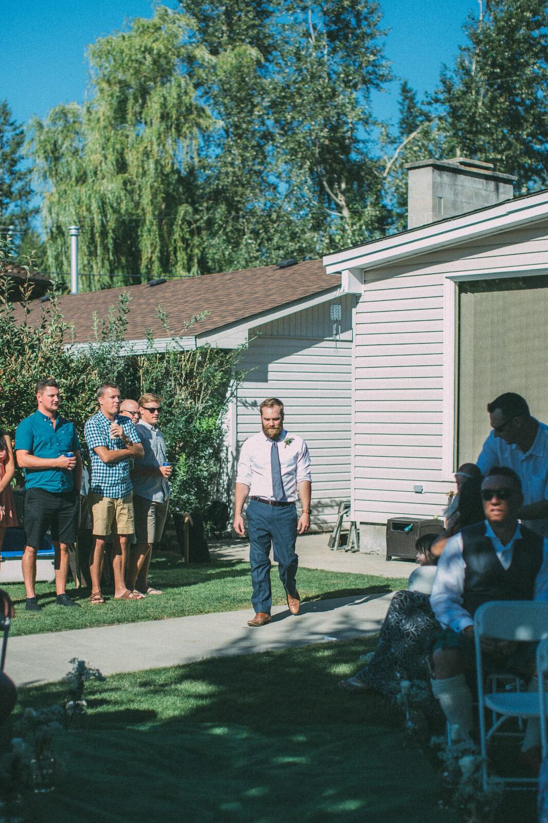 Megan and Jarid weddings story frame 17: A Shuswap-area wedding around Sicamous, Swansea Point and Hyde Mountain, with boat/lake context, cliff portraits and strong floral colour..