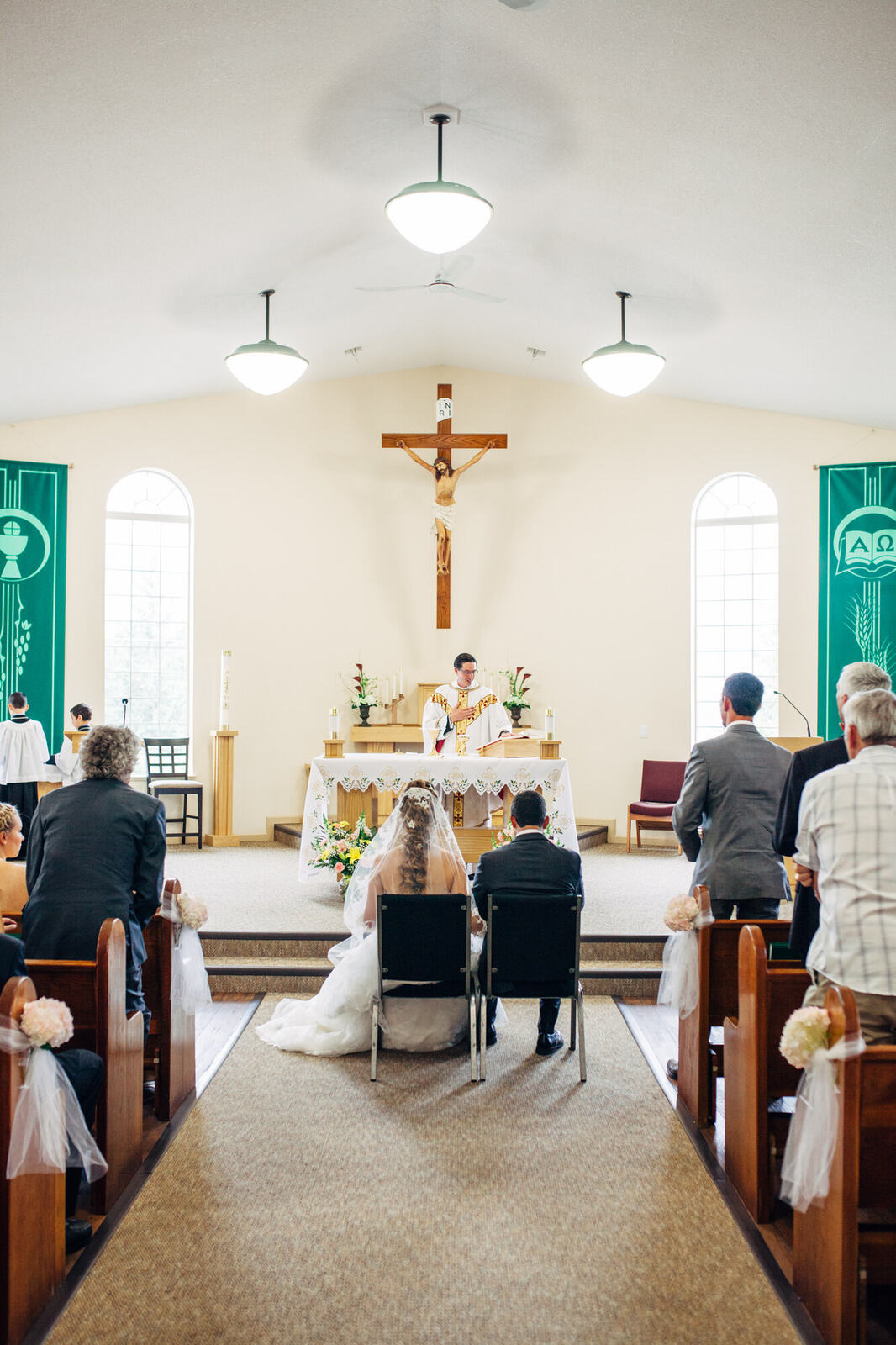 The church ceremony framed from the aisle