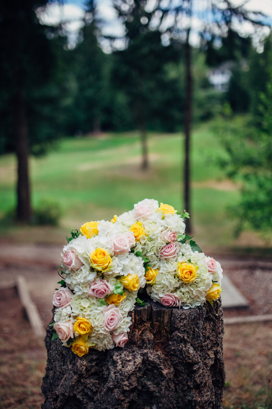 Yellow and white wedding bouquet outdoors