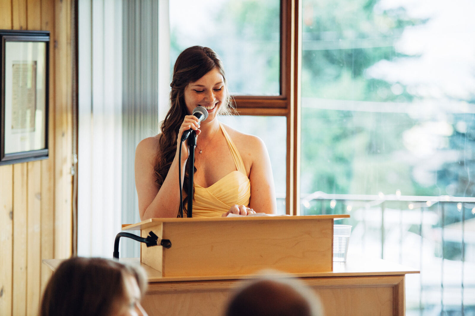 Reception speech beside windows overlooking Blind Bay