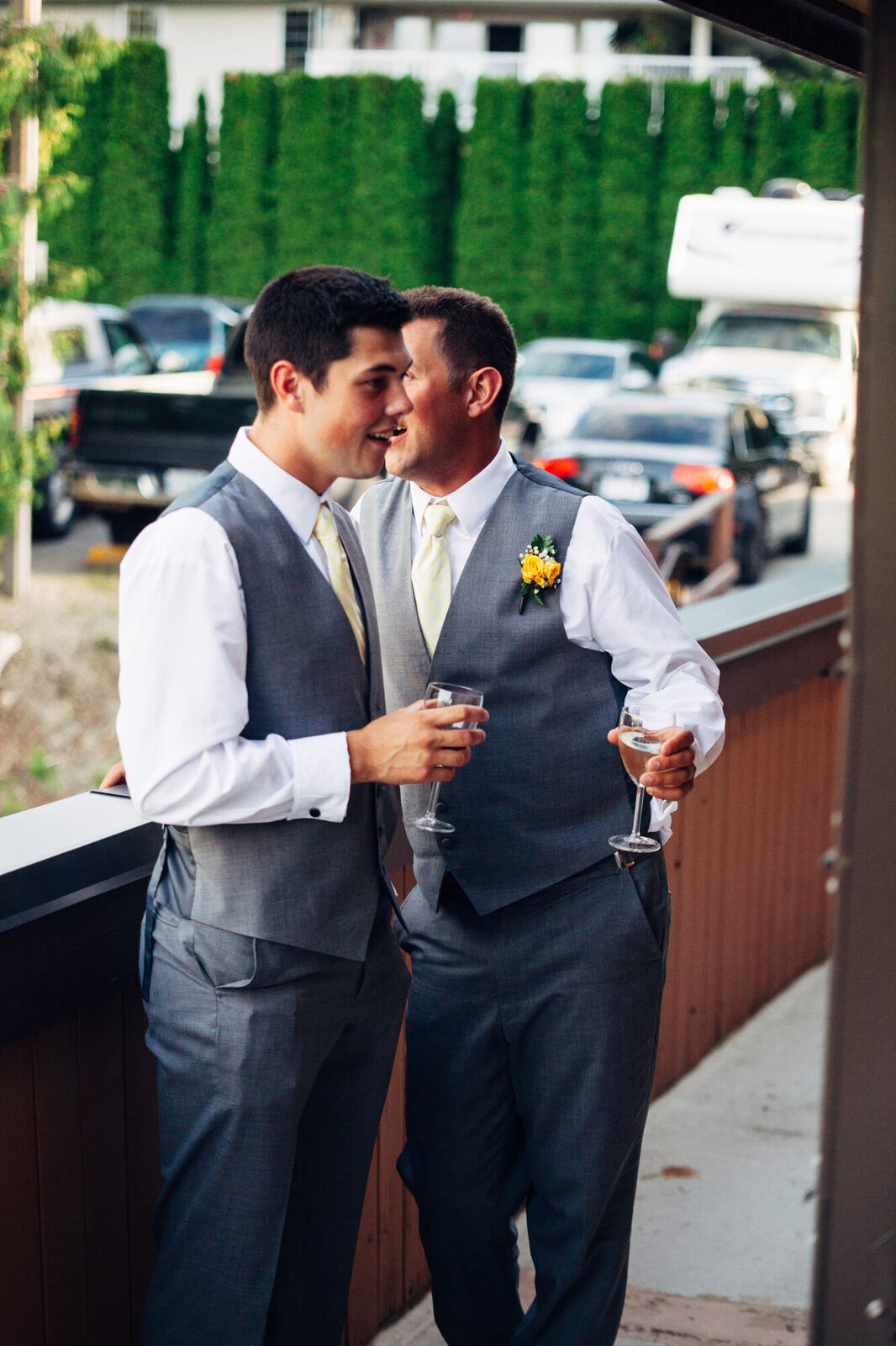 Blaise laughing with a friend outside the reception