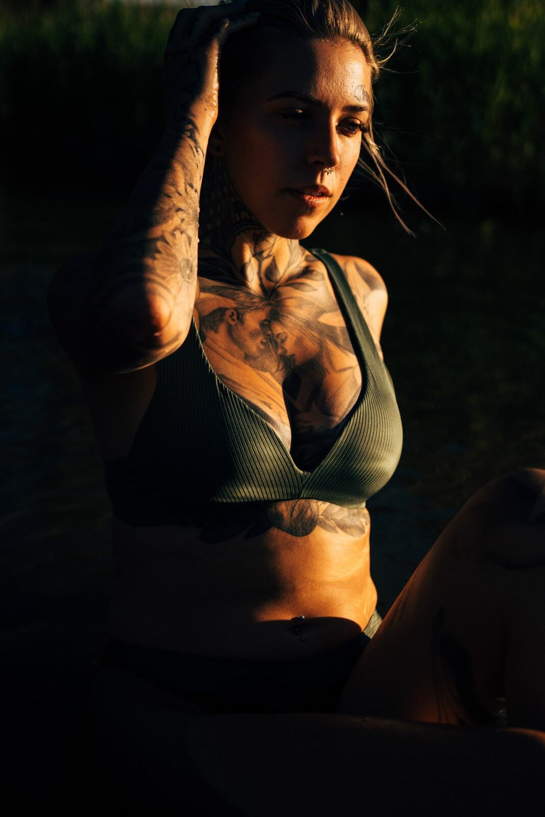 Rayleigh by Knox portraits story frame 9: Knox Mountain portraits in Kelowna with white floral dress, tattoo detail, reeds, water, sunlight and a stronger summer edge.