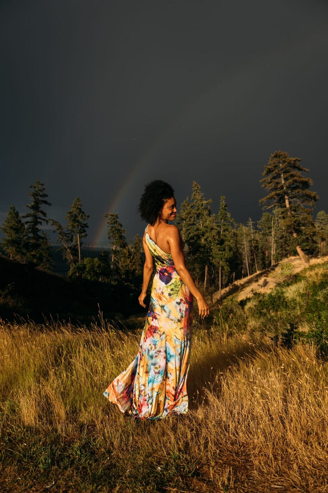 Rebekah at Bertram portraits story frame 3: A Bertram portrait story moving from floral dress and lake light into black dress, white shirt, sunset and water silhouettes.