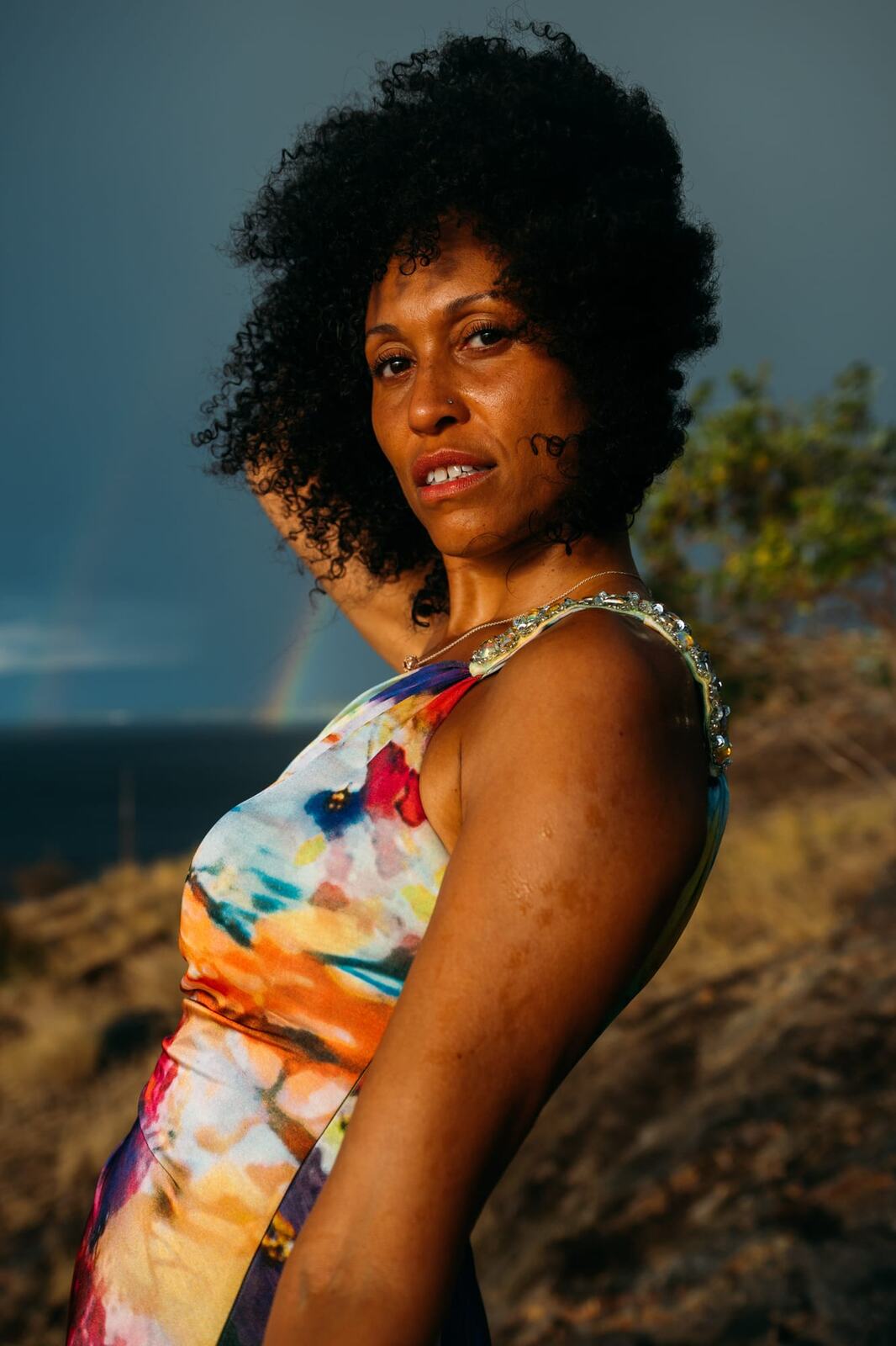 Rebekah at Bertram portraits story frame 6: A Bertram portrait story moving from floral dress and lake light into black dress, white shirt, sunset and water silhouettes.