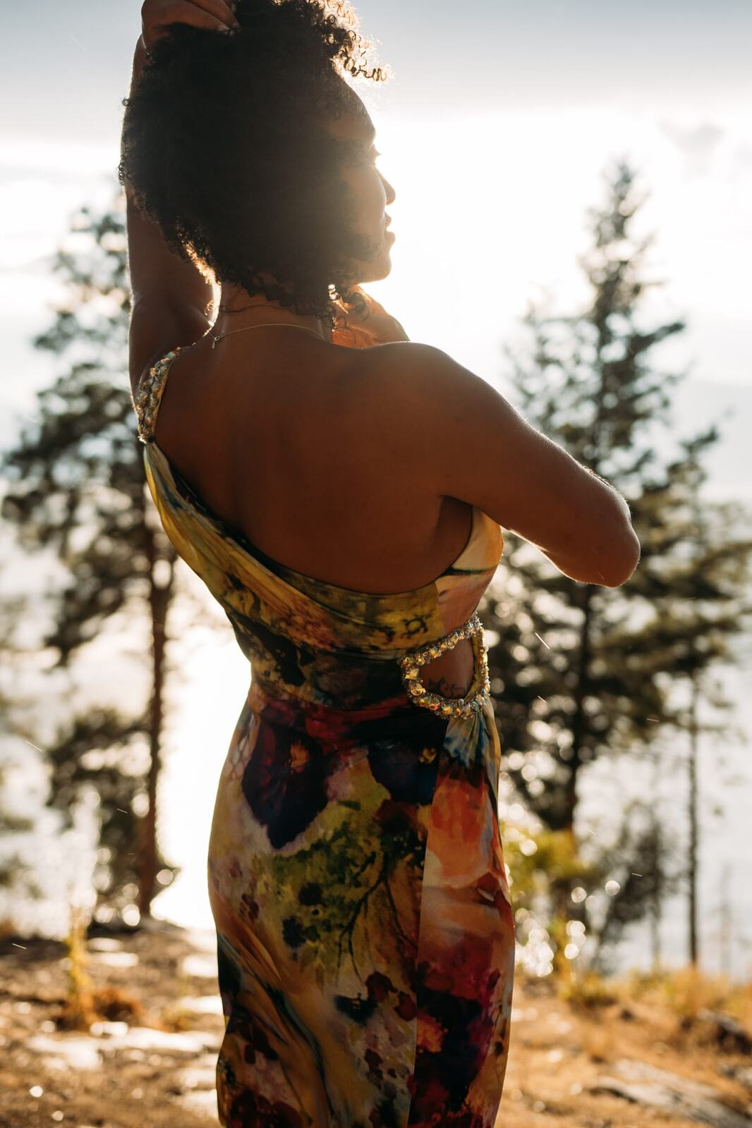 Rebekah at Bertram portraits story frame 8: A Bertram portrait story moving from floral dress and lake light into black dress, white shirt, sunset and water silhouettes.