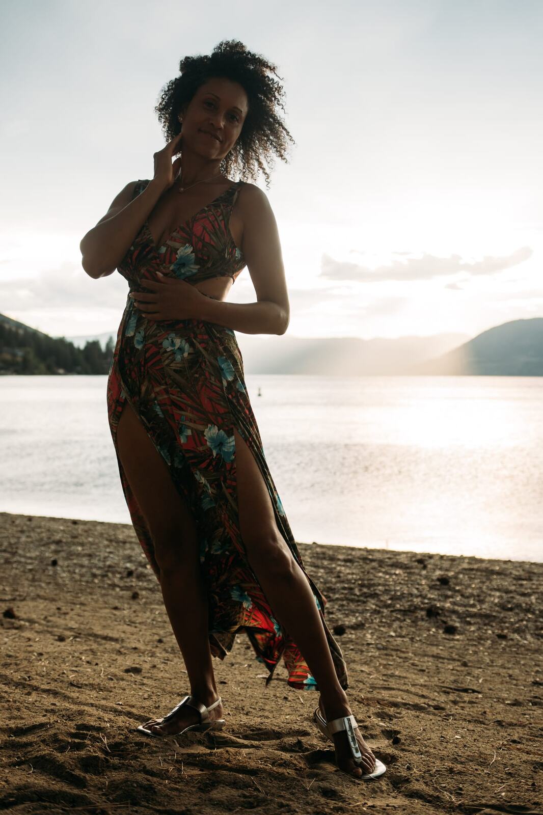 Rebekah at Bertram portraits story frame 9: A Bertram portrait story moving from floral dress and lake light into black dress, white shirt, sunset and water silhouettes.