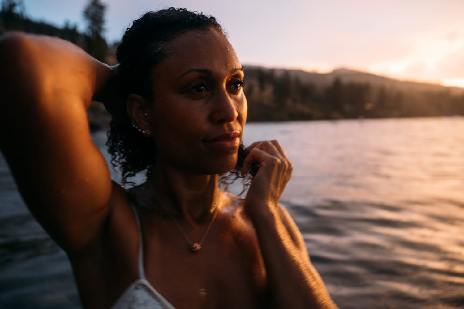 Rebekah at Bertram portraits story frame 18: A Bertram portrait story moving from floral dress and lake light into black dress, white shirt, sunset and water silhouettes.