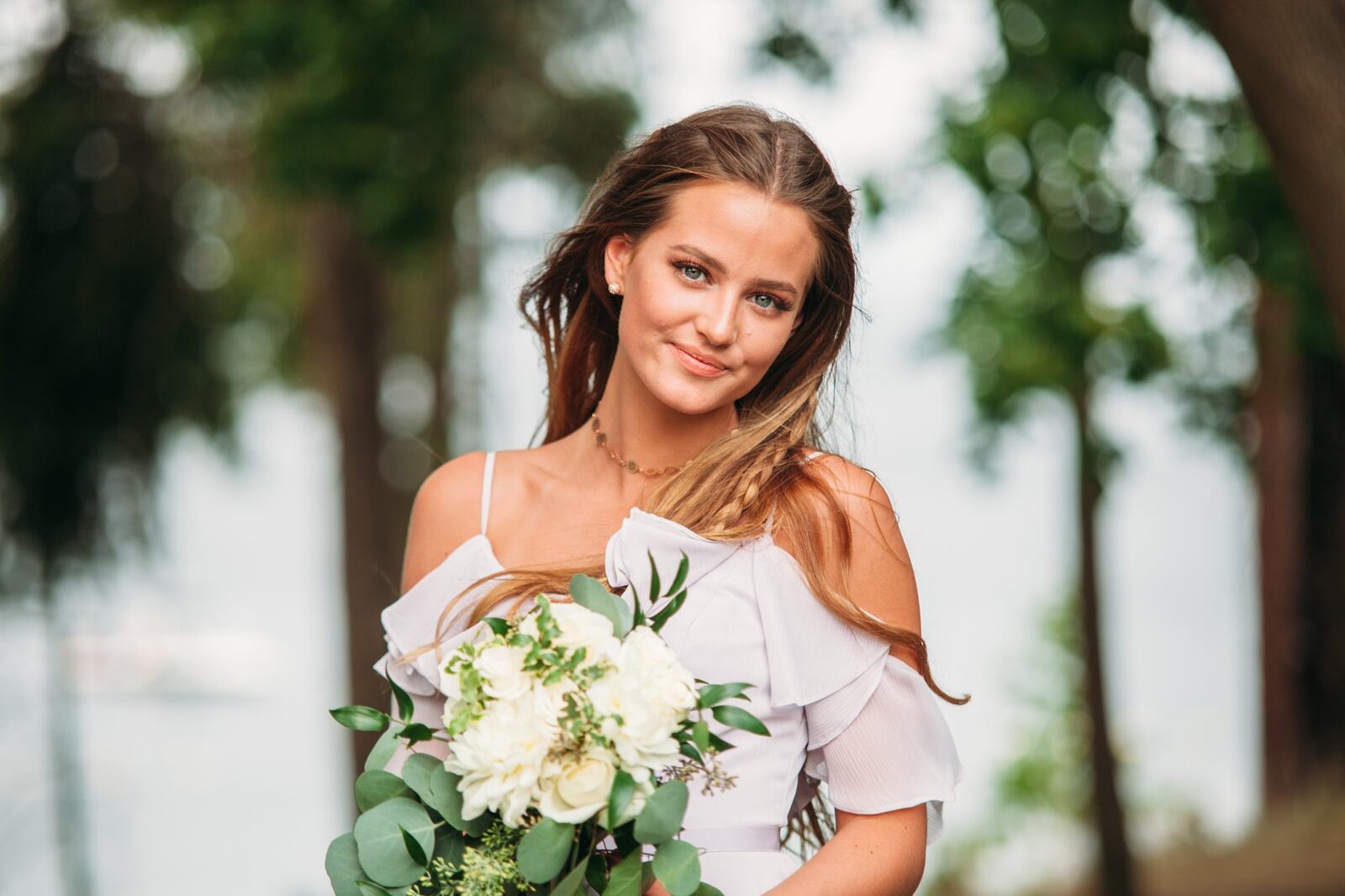 Bridesmaid portrait beside the lake