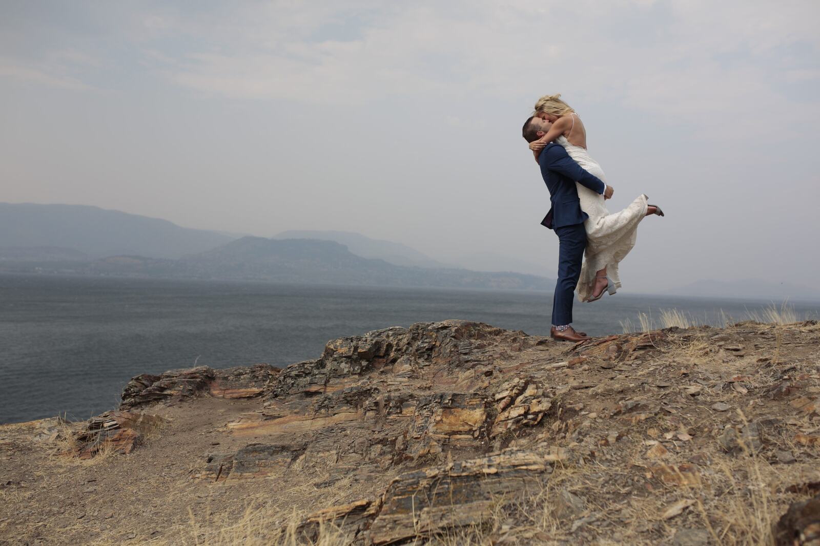 Sarah and Greg celebrating above the lake