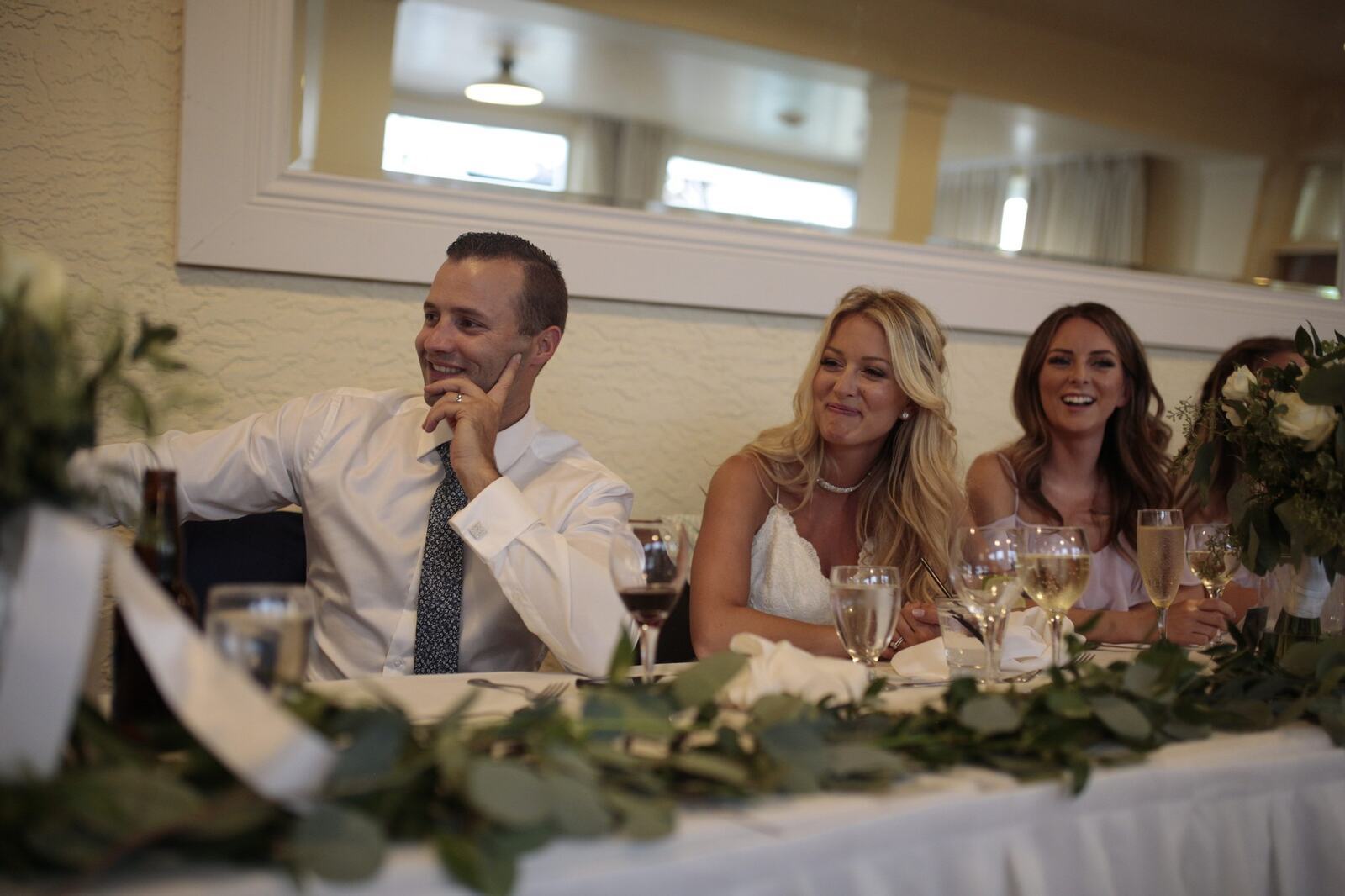 A reception guest reacting during the speeches