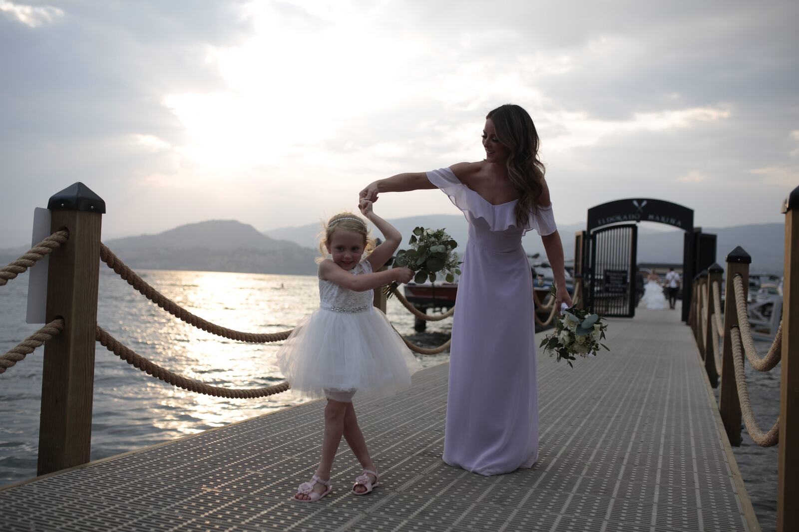 Sarah and Greg dancing together on the dock