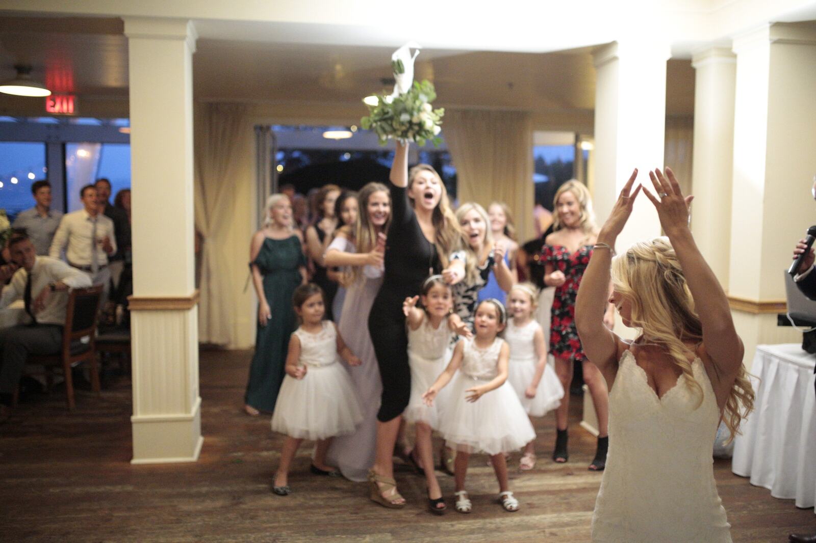 Sarah tossing her bouquet during the reception