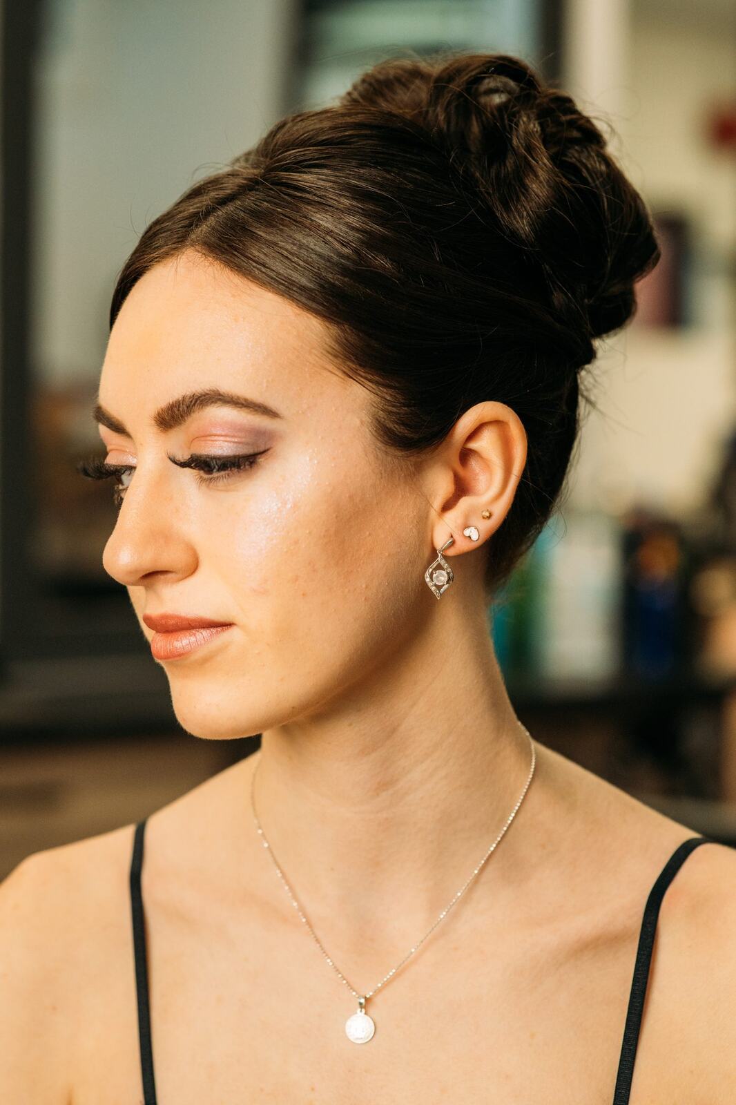 Sass Hair and Diva Den corporate story frame 1: Special-event, prom and grad beauty portraits for Sass Hair and Diva Den in Kelowna, with finished hair, makeup, salon atmosphere and polished vendor images..