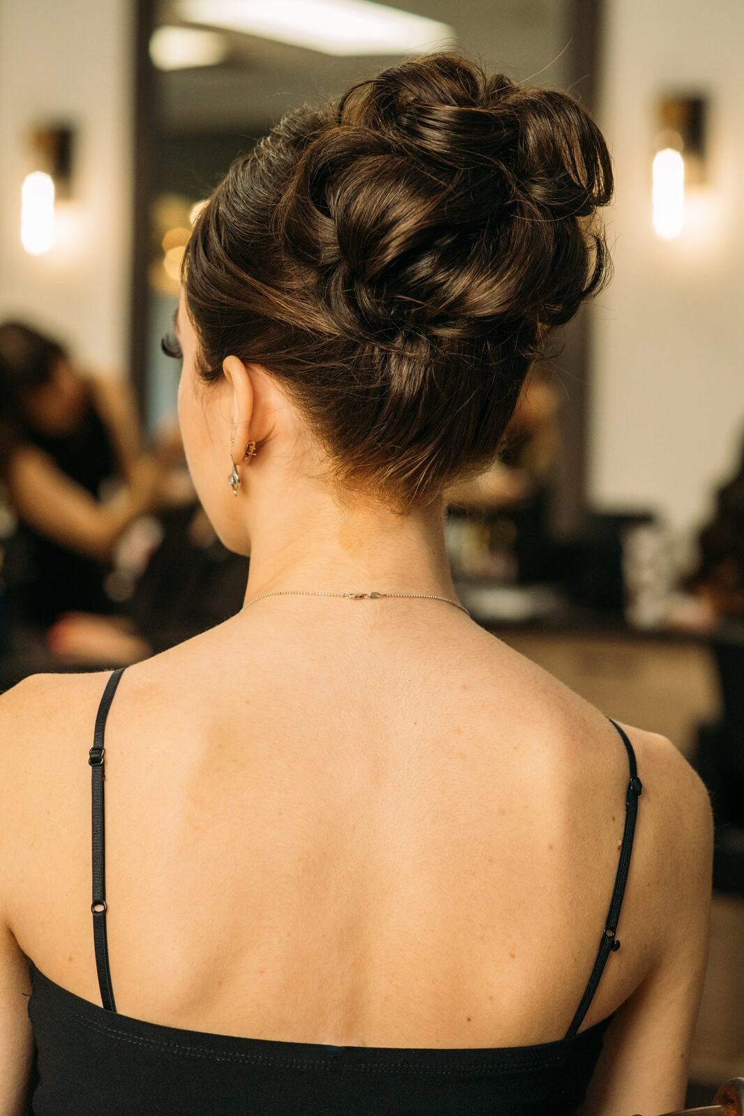 Sass Hair and Diva Den corporate story frame 6: Special-event, prom and grad beauty portraits for Sass Hair and Diva Den in Kelowna, with finished hair, makeup, salon atmosphere and polished vendor images..