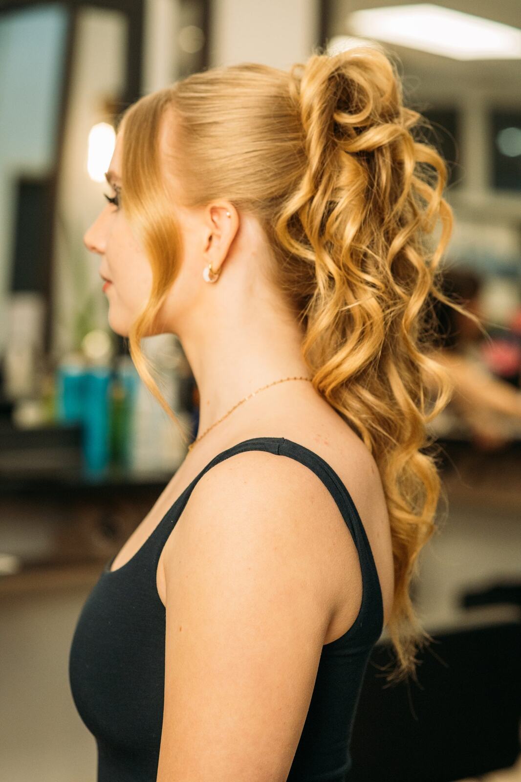 Sass Hair and Diva Den corporate story frame 29: Special-event, prom and grad beauty portraits for Sass Hair and Diva Den in Kelowna, with finished hair, makeup, salon atmosphere and polished vendor images..