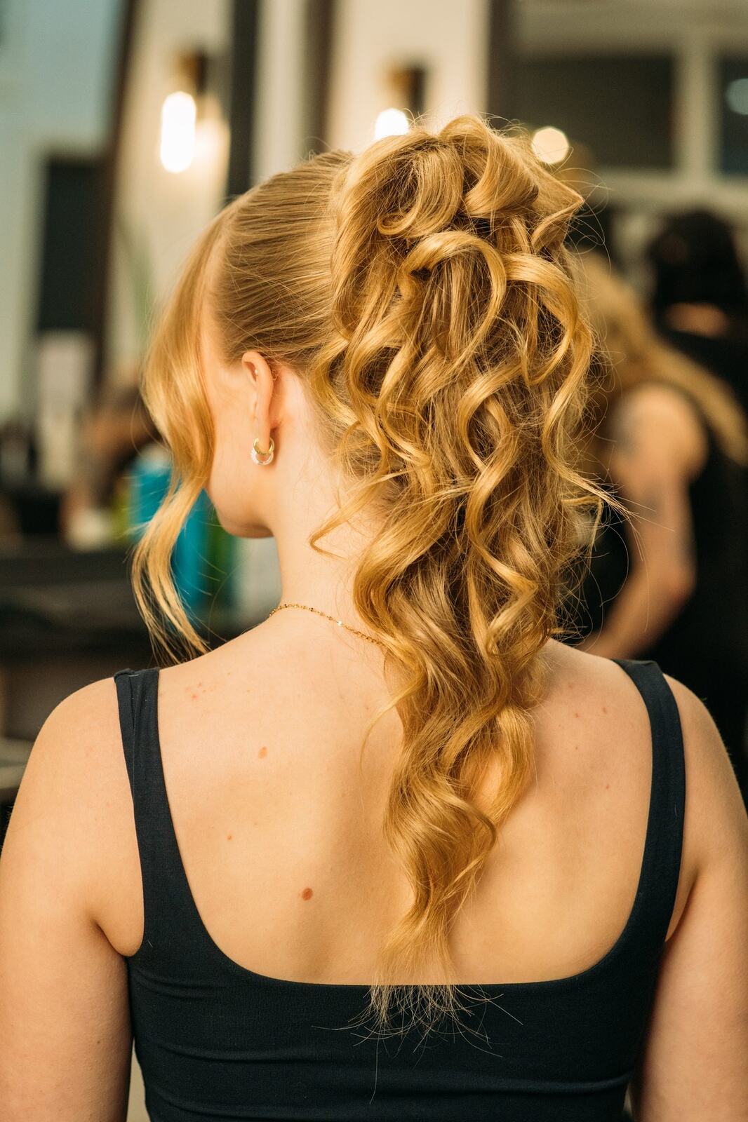 Sass Hair and Diva Den corporate story frame 30: Special-event, prom and grad beauty portraits for Sass Hair and Diva Den in Kelowna, with finished hair, makeup, salon atmosphere and polished vendor images..