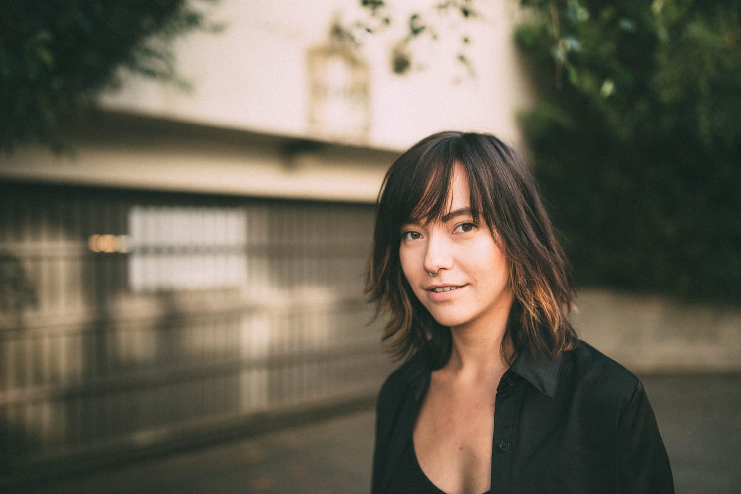 Savannah in Vancouver portraits story frame 12: Vancouver portraits for Savannah with pale walls, green city paths, soft street light and a gentle late-afternoon portrait rhythm.