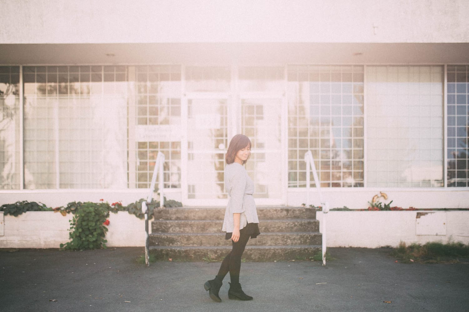 Savannah in Vancouver portraits story frame 15: Vancouver portraits for Savannah with pale walls, green city paths, soft street light and a gentle late-afternoon portrait rhythm.