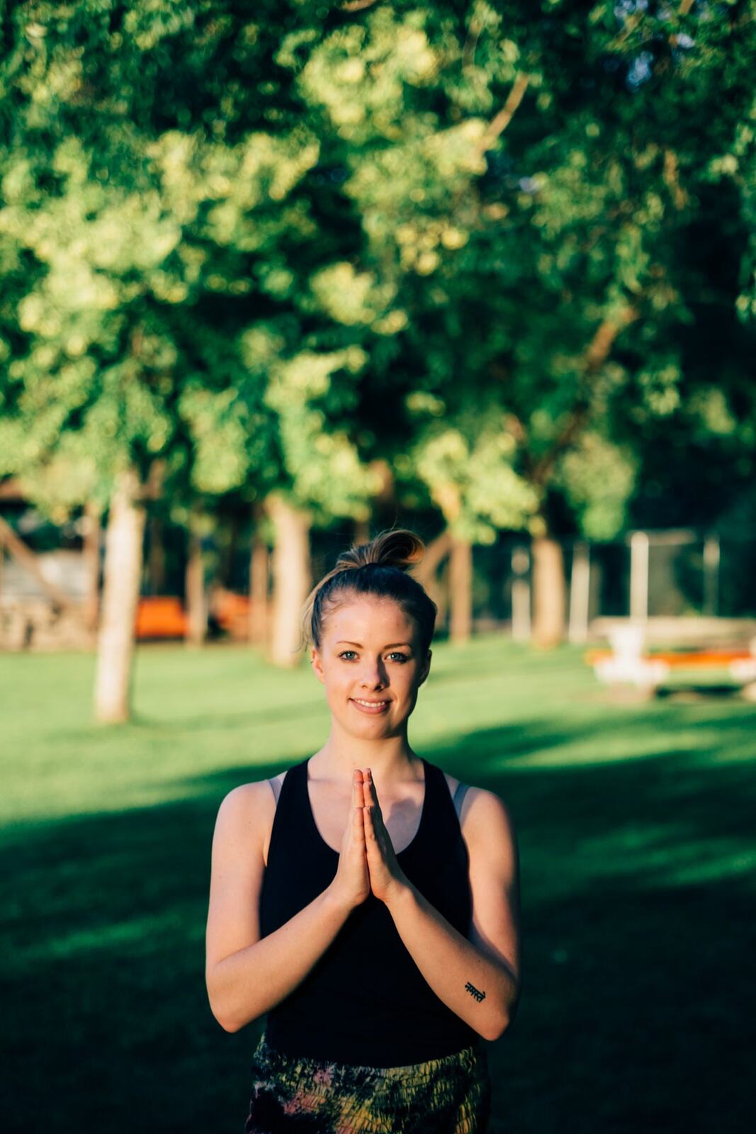 Shani Yoga corporate story frame 16: Wellness portraits for Shani with yoga movement, shoreline light and wooded settings, created for a personal brand with an active outdoor focus.