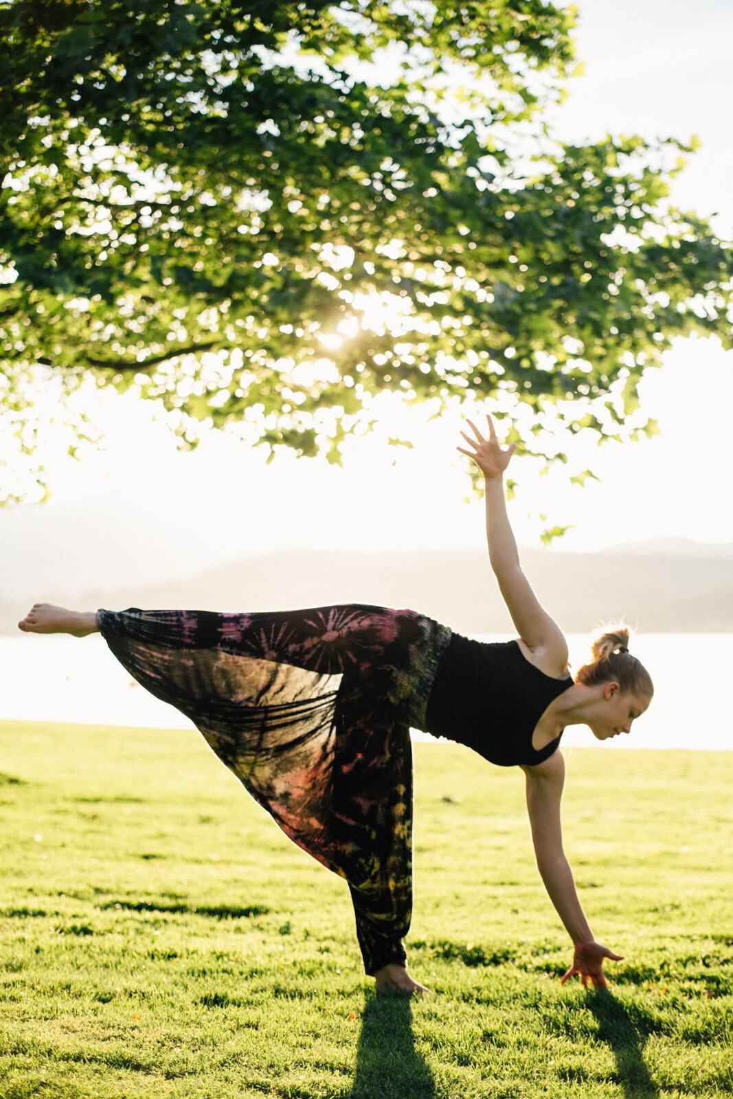 Shani Yoga corporate story frame 23: Wellness portraits for Shani with yoga movement, shoreline light and wooded settings, created for a personal brand with an active outdoor focus.