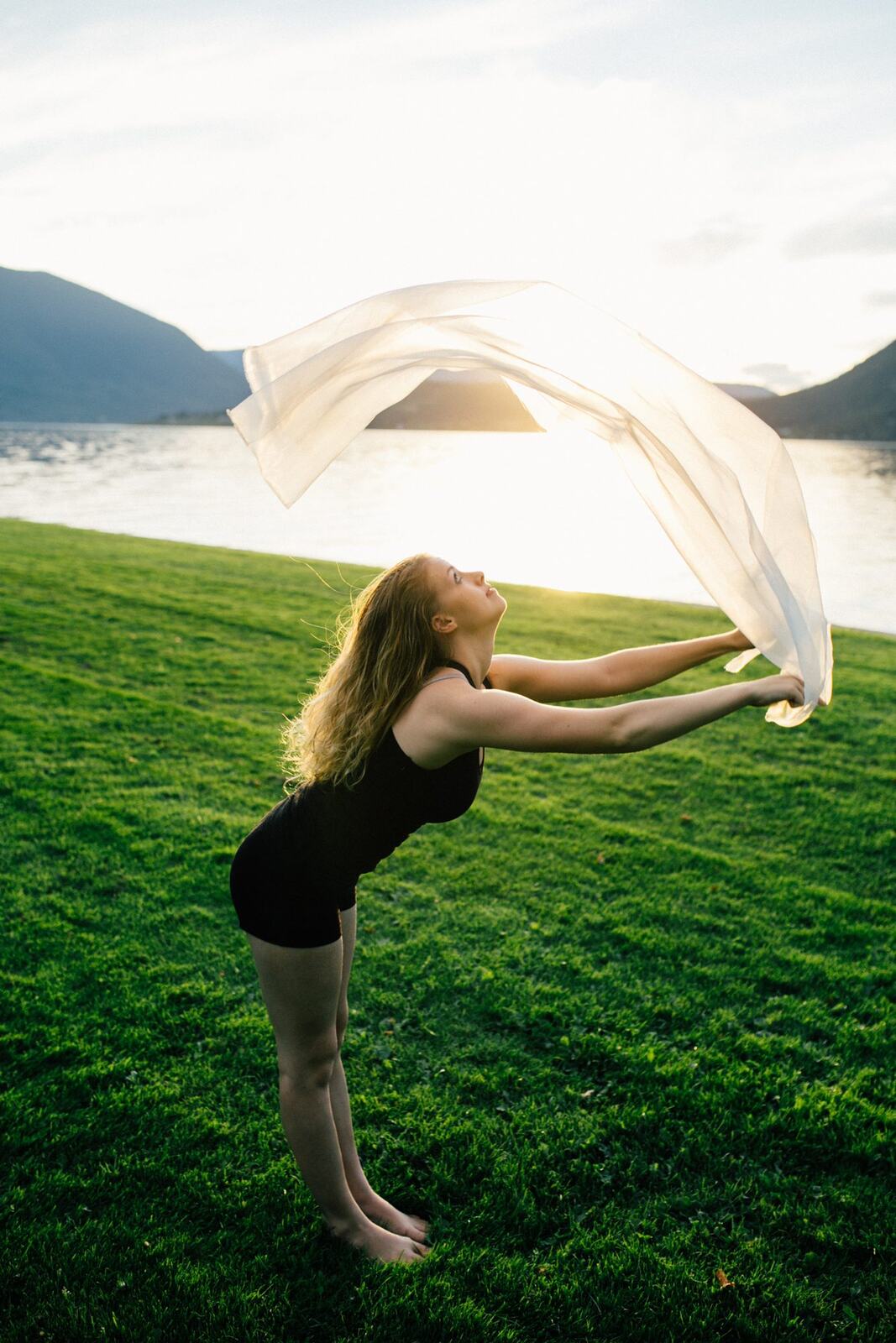 Shani Yoga corporate story frame 38: Wellness portraits for Shani with yoga movement, shoreline light and wooded settings, created for a personal brand with an active outdoor focus.