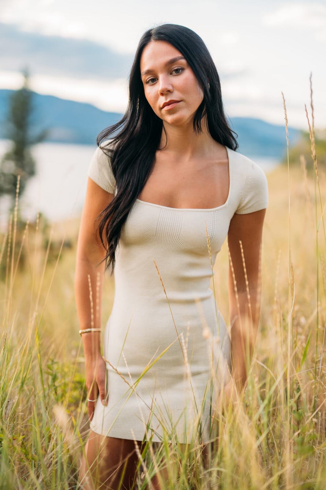 Shaylin at Bertram portraits story frame 4: A large Bertram session with water, green shade, outfit changes and Okanagan location detail that gives the story a clear place.