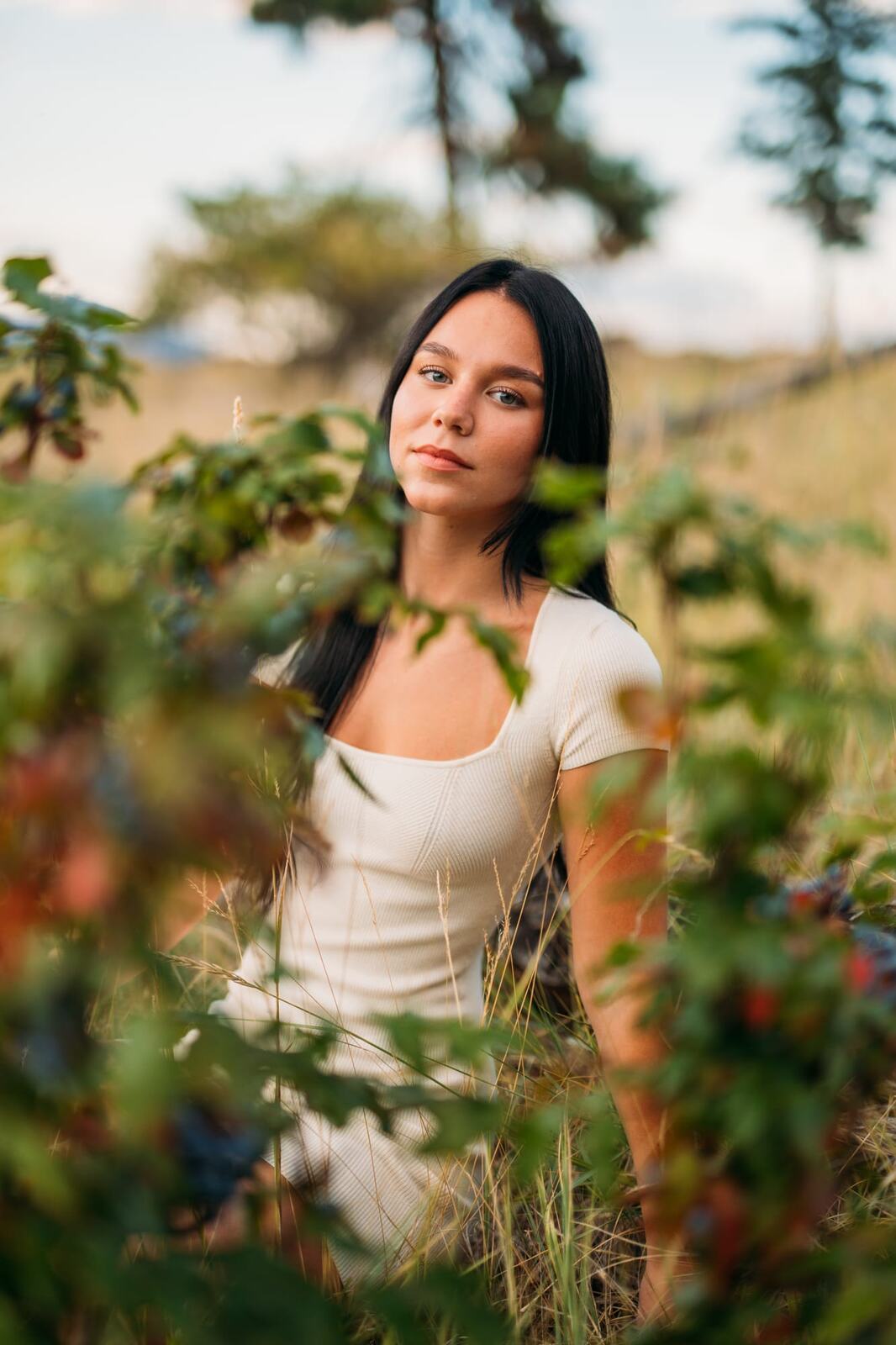 Shaylin at Bertram portraits story frame 5: A large Bertram session with water, green shade, outfit changes and Okanagan location detail that gives the story a clear place.