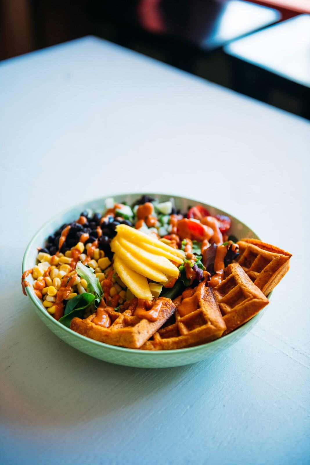 Smudge Noshery corporate story frame 10: Food and hospitality brand photography for Smudge Noshery in Salmon Arm, BC, with colourful flatlays, smoothies, bowls, cafe details and commercial product images for a local restaurant..