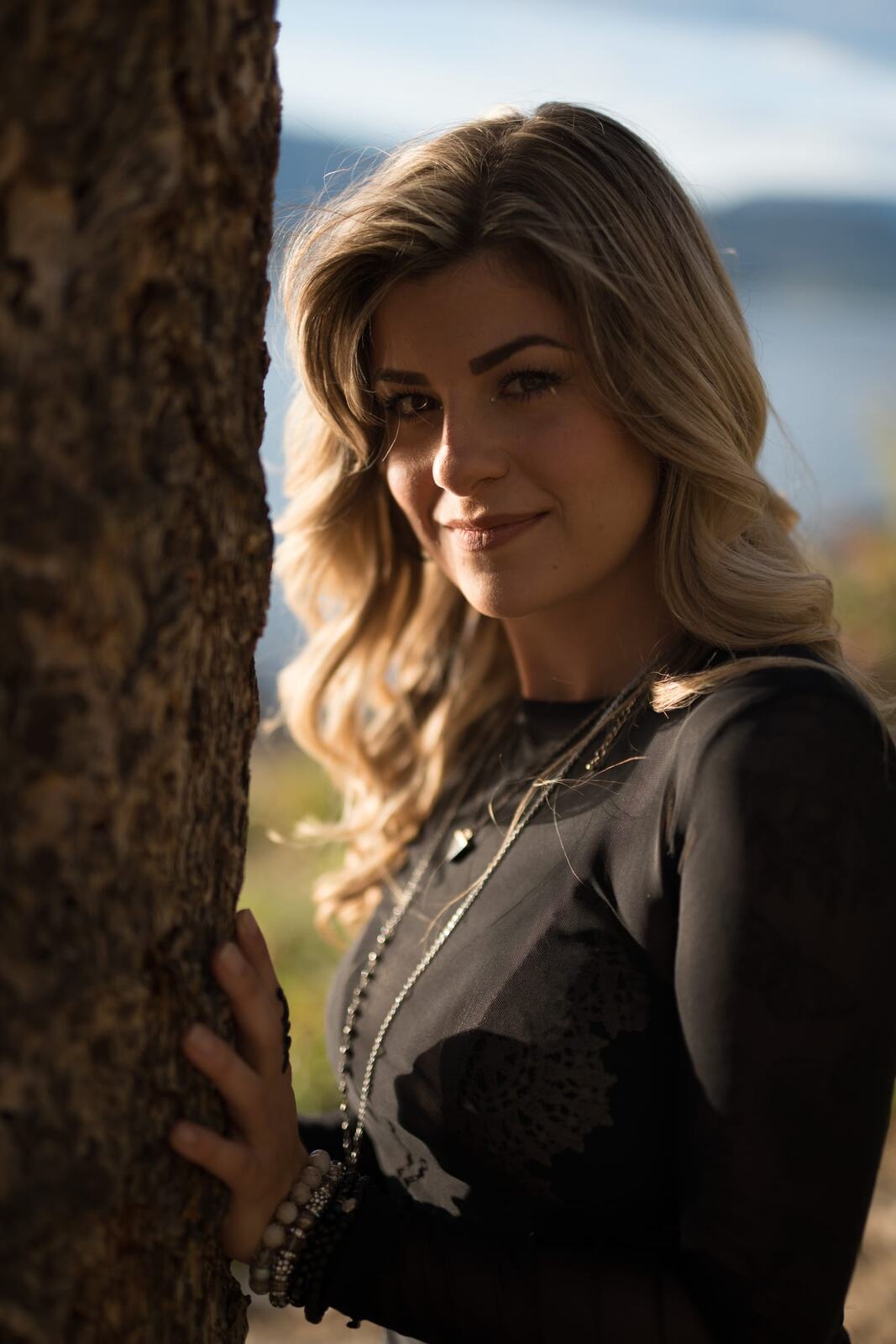 Sophia by the Water and Trees portraits story frame 5: Black outfits, water, trees, swimwear and a confident, sensual portrait story.